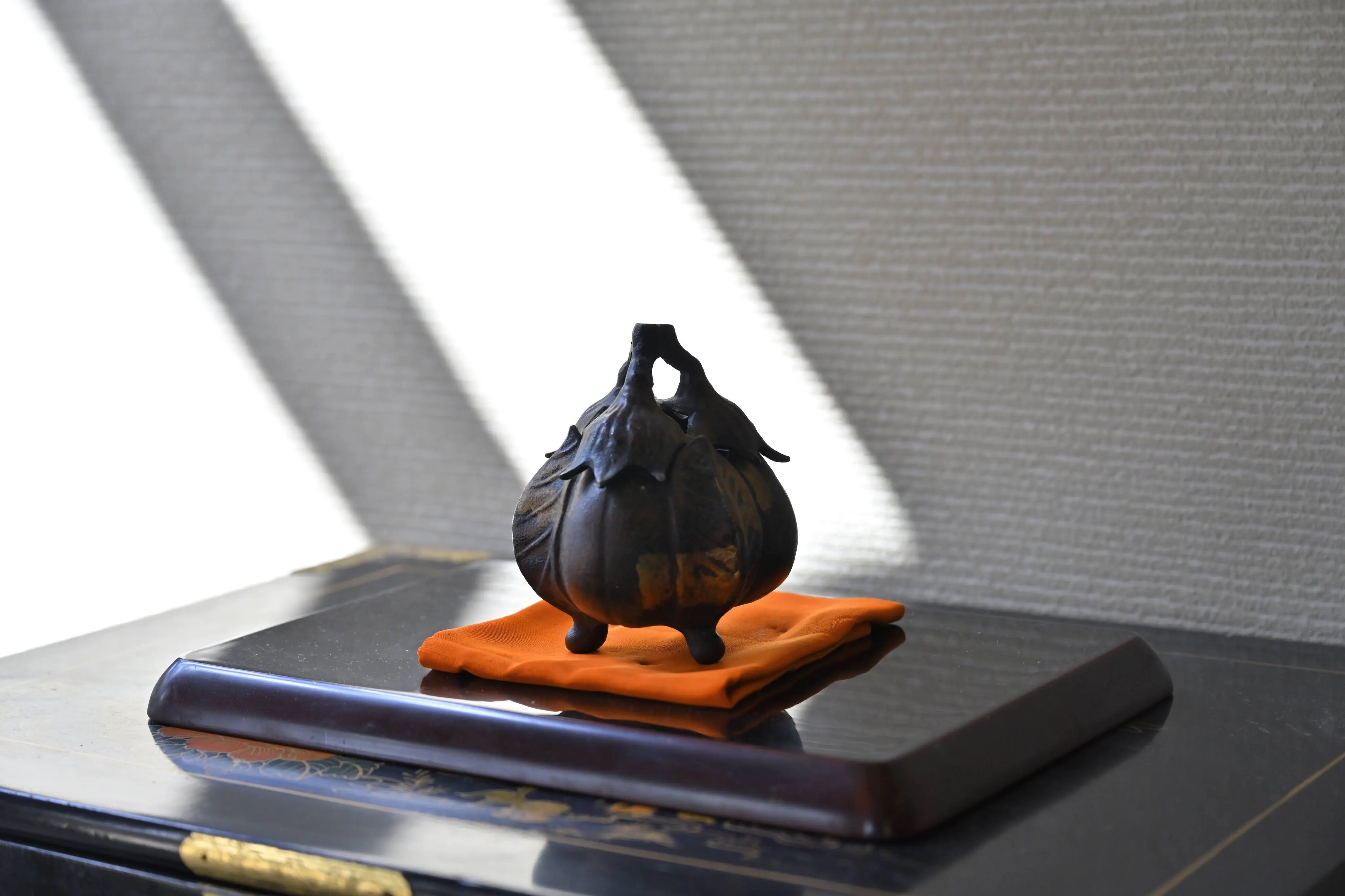 The incense burner in the alcove. Arrangements change with the season.